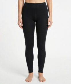 Black base layer pants. Merino Pants are made of 100% merino wool and should be worn during activities where extra warmth and good moisture transport are needed.  The image shows a female model from the front.