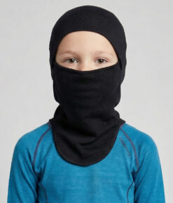 Bagheera black Balaclava in 100% merino wool for half or full face protection. The picture shows a 6 year old boy model from the front.