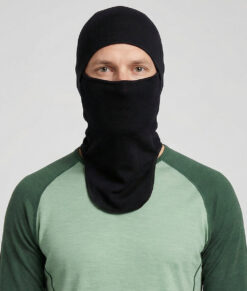 Bagheera black Balaclava in 100% merino wool for half or full face protection. The image shows a male model from the front.