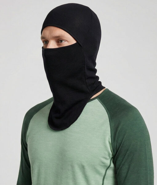 Bagheera black Balaclava in 100% merino wool for half or full face protection. The picture shows a male model from the front.