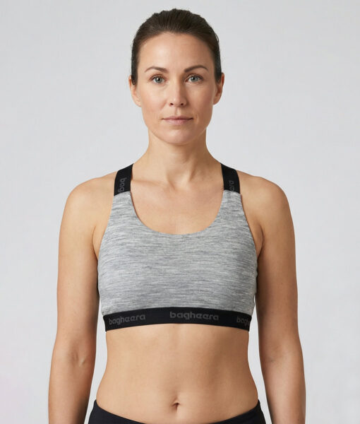 The Merino Sports Bra is a light grey soft and comfortable sports bra with light support. The unique properties of merino wool mean that it keeps you warm even when you sweat, which gives you a comfortable feeling.  The image shows a female model from the front.