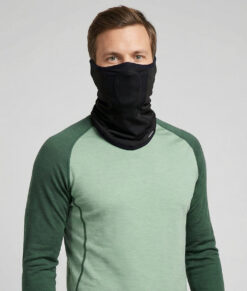 Turtle Neck Pro is a comfortable face and neck protector for cold weather. The centered mesh section allows you to breathe freely while protecting your mouth and nose. Smart earloops keep the product in place. The image shows a male model from the front.