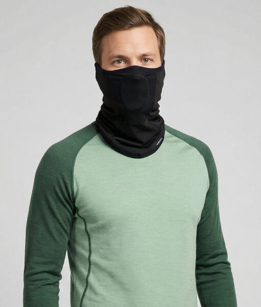 Turtle Neck Pro is a comfortable face and neck protector for cold weather. The centered mesh section allows you to breathe freely while protecting your mouth and nose. Smart earloops keep the product in place. The image shows a male model from the front.