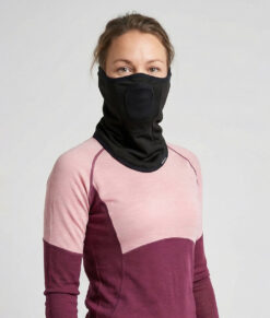 Turtle Neck Pro is a comfortable face and neck protector for cold weather. The centered mesh section allows you to breathe freely while protecting your mouth and nose. Smart ear loops keep the product in place. The image shows a female model from the front.