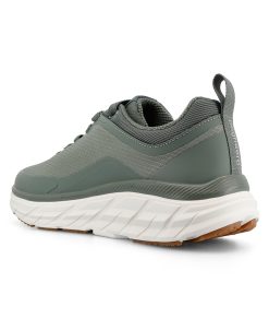 Zector är en grön/benvit, vattentät sneaker designad för hög komfort och daglig användning. Visad snett bakifrån.