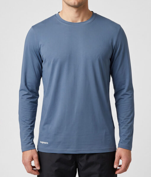 Male model shows off a dove blue Bagheera long-sleeved training shirt. . The model is shown from the front in a studio against a light gray background.