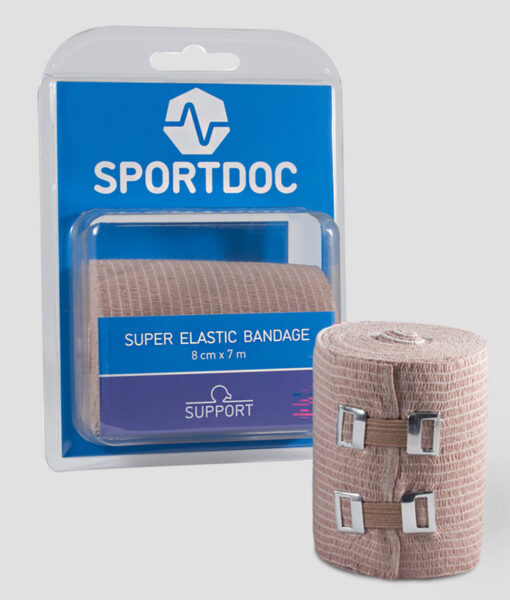 En rulle beige Sportdoc super elastic bandage 8cm bred. Bandaget visas framifrån mot ljusgrå bakgrund.